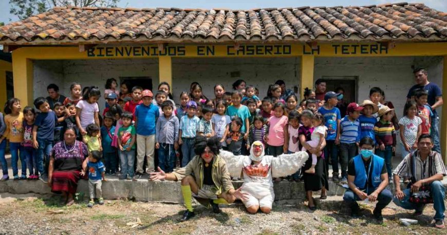 Group photo after clown show in Huehuetenango, Guatemala for migrants and their families.